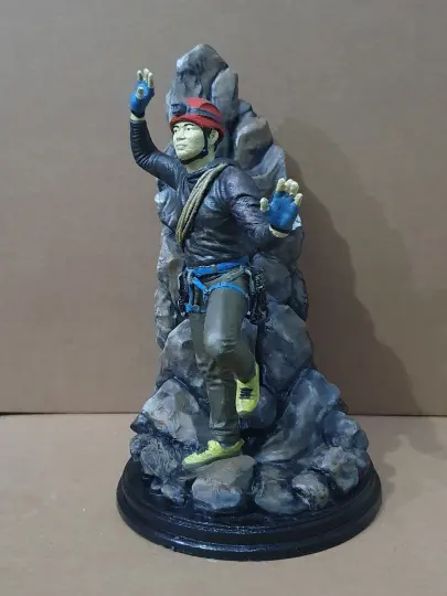 Figur pemanjat tebing, tampak samping